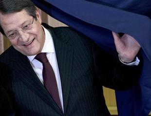 Anastasiades wins election, vows for a solution accepted by Turkish Cypriots