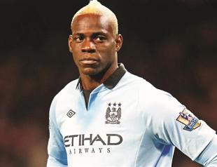 Berlusconi apologizes to Balotelli