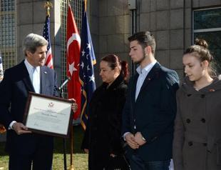 US Secretary Kerry honors family of embassy attack victim