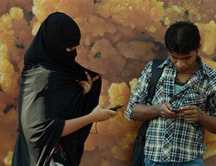 Indian women use smartphones to pin the creeps