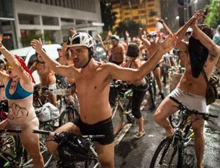 Naked cyclists on protest rides in Brazil, Peru