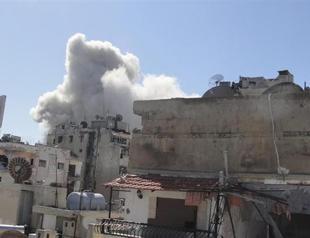 Jets bomb Homs district, Qaeda claims killing Syrian troops