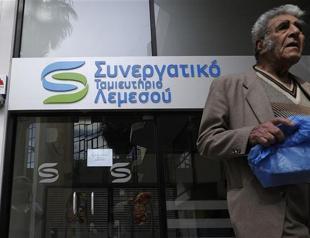 Greek Cyprus postpones debate on controversial EU bailout