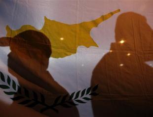 Greek Cyprus says banks to reopen with tight controls