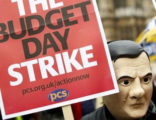Tens of thousands join British budget day strike