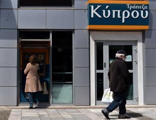 Greek Cyprus banks to stay shut as world markets take fright