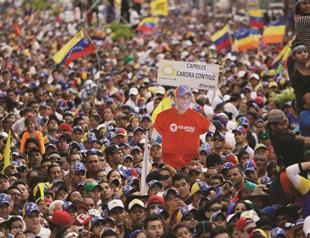 Ghost of Hugo Chavez haunts Venezuela election campaign
