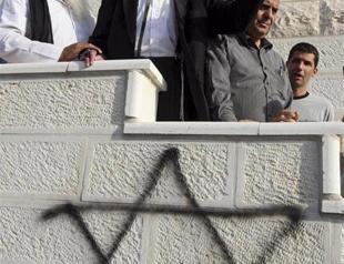 Vandals target West Bank mosques, scrawl threats in Hebrew