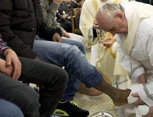 Pope washes womens feet in break with church law