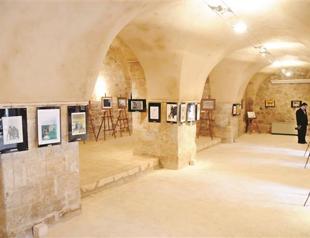 Aydın Doğan cartoons on display in Mardin