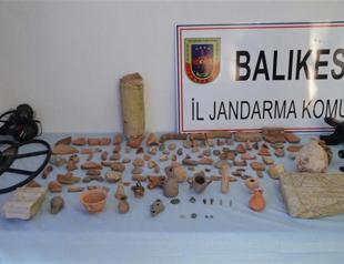 One detained as hundreds of historic artifacts found in Aegean province
