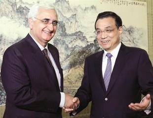 China downplays friction with India ahead of visit