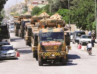 Turkey’s Syria border tense as army deploys armored vehicles