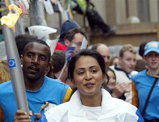 Russian astronauts to take Olympic torch on space walk