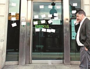 European Union, IMF warn Spain of risks to local banks