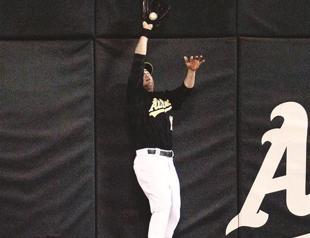 A’s stave off late rally to overcome Yankees