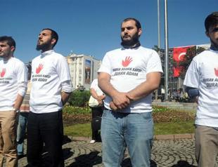 Group stands against standing man in Istanbul protest square