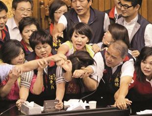 Taiwan lawmakers throw coffee in row