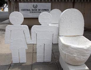 Fitch and S&P downgrade Greek Cyprus ratings over debt swap