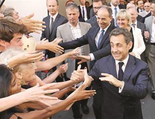 France’s Sarkozy back on stage to save UMP