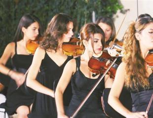 Youth orchestra on stage in two countries