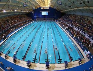 Iran swimmer says record denied over unIslamic costume