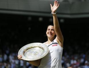 Bartoli routs Lisicki to win first Wimbledon title
