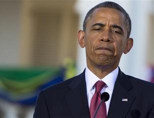 Obama urges calm in Zimmerman case as thousands protest