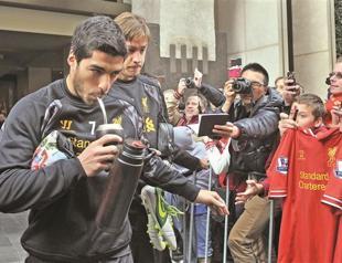 Liverpool’s Rodgers expects Suarez to stay with the team
