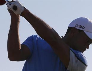 Woods eyes 15th major title at sun-kissed Muirfield
