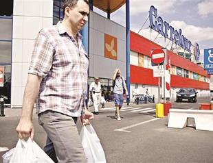 Carrefour sales slump after market pull outs