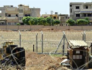 Stray bullets hit houses and offices in Ceylanpınar as clashes continue