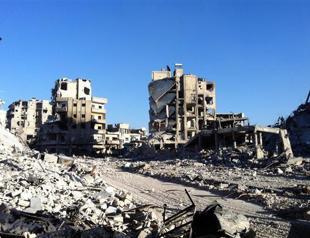 Syria army retakes key Homs rebel district: state TV