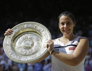 Injuries force Wimbledon champ Bartoli to retire