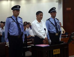 Defiant Bo denies bribery charge as China trial opens