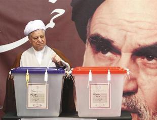 Iran votes for president, Khamanei slams doubts