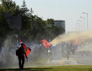 Police intervene with water cannons and tear gas in union march in Ankara