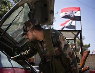 Syria evacuates most army buildings in Damascus: Residents