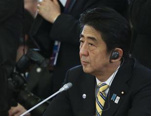 Japan PM urges reset in ties at first meet with Chinas Xi