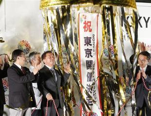 Japan vows stand-out Games, eyes record haul