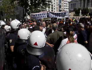 Greek police scuffle with school guards, teachers kick off strike