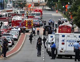 US Navy Yard shooting toll rises to 13, suspect named