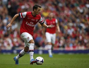 Özil inspires leader Arsenal to 3-1 win over Stoke