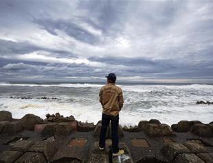 Typhoon hits Japan as Fukushima operator releases water into sea