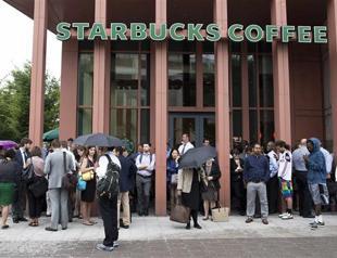 Starbucks says guns unwelcome, though not banned