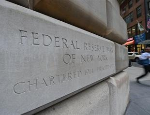 Fed keeps stimulus in place, worried about rise in borrowing costs