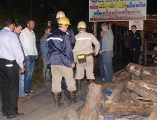 Miners walk out from coal mine wreckage in northern Turkish province