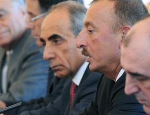 Azeri journalist, critic of President Aliyev arrested before election