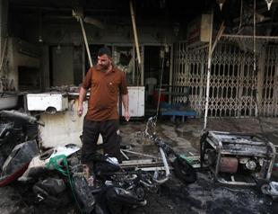 Blasts at Iraq police station, school kill 15