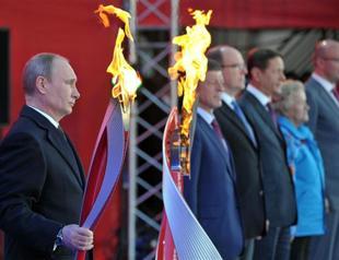 Putin receives flame for Russias Olympic Games